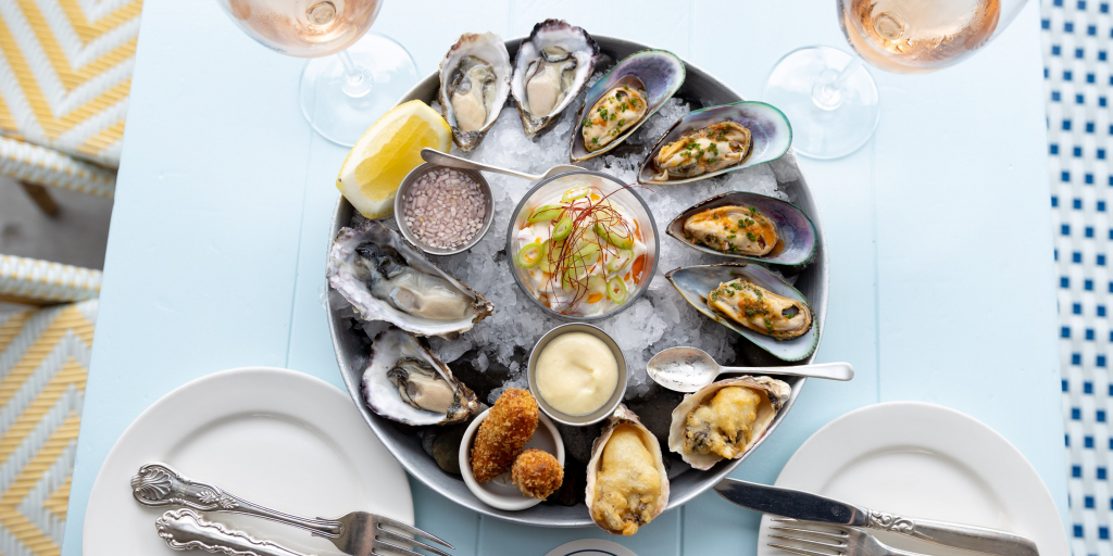 The Oyster Inn on Waiheke Island is an award-winning beachside bistro with views across Oneroa Bay.